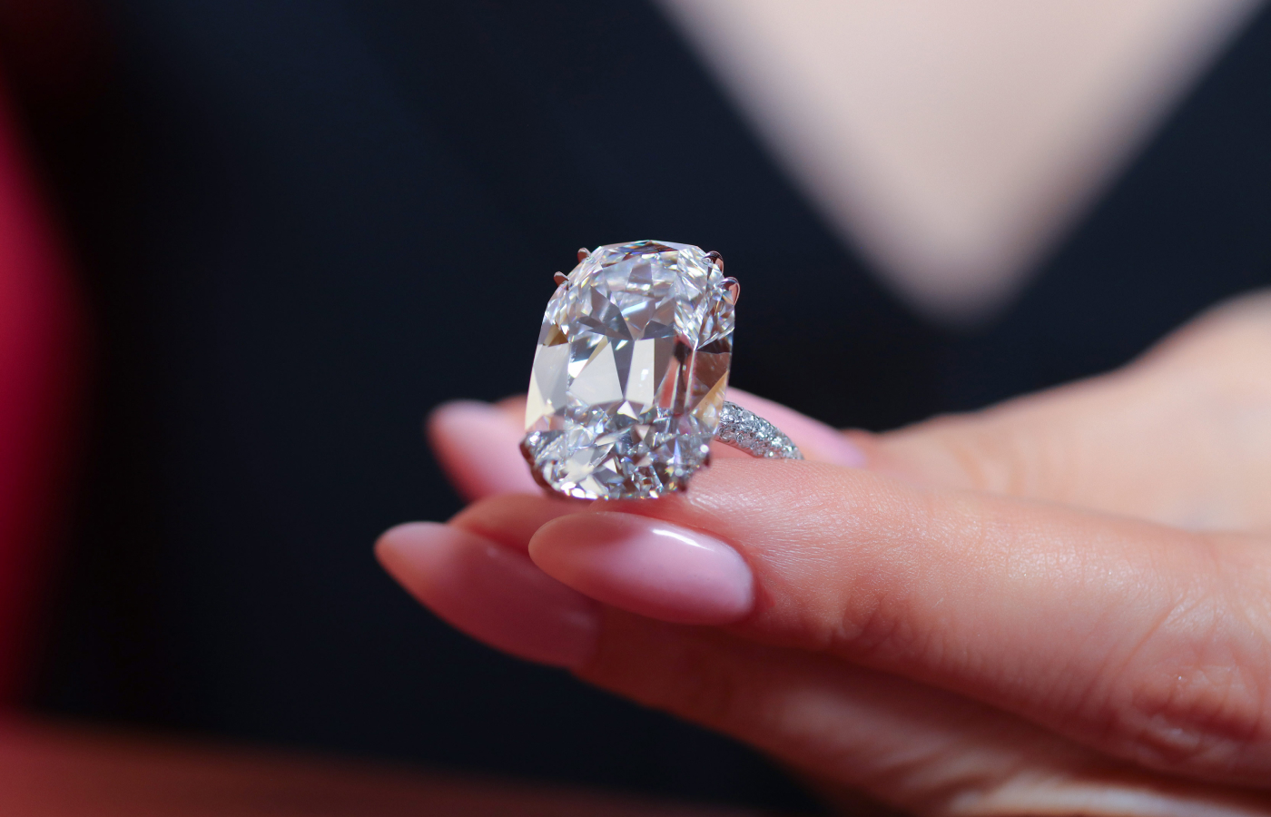 Katerina Perez holding a 4-ct diamond ring