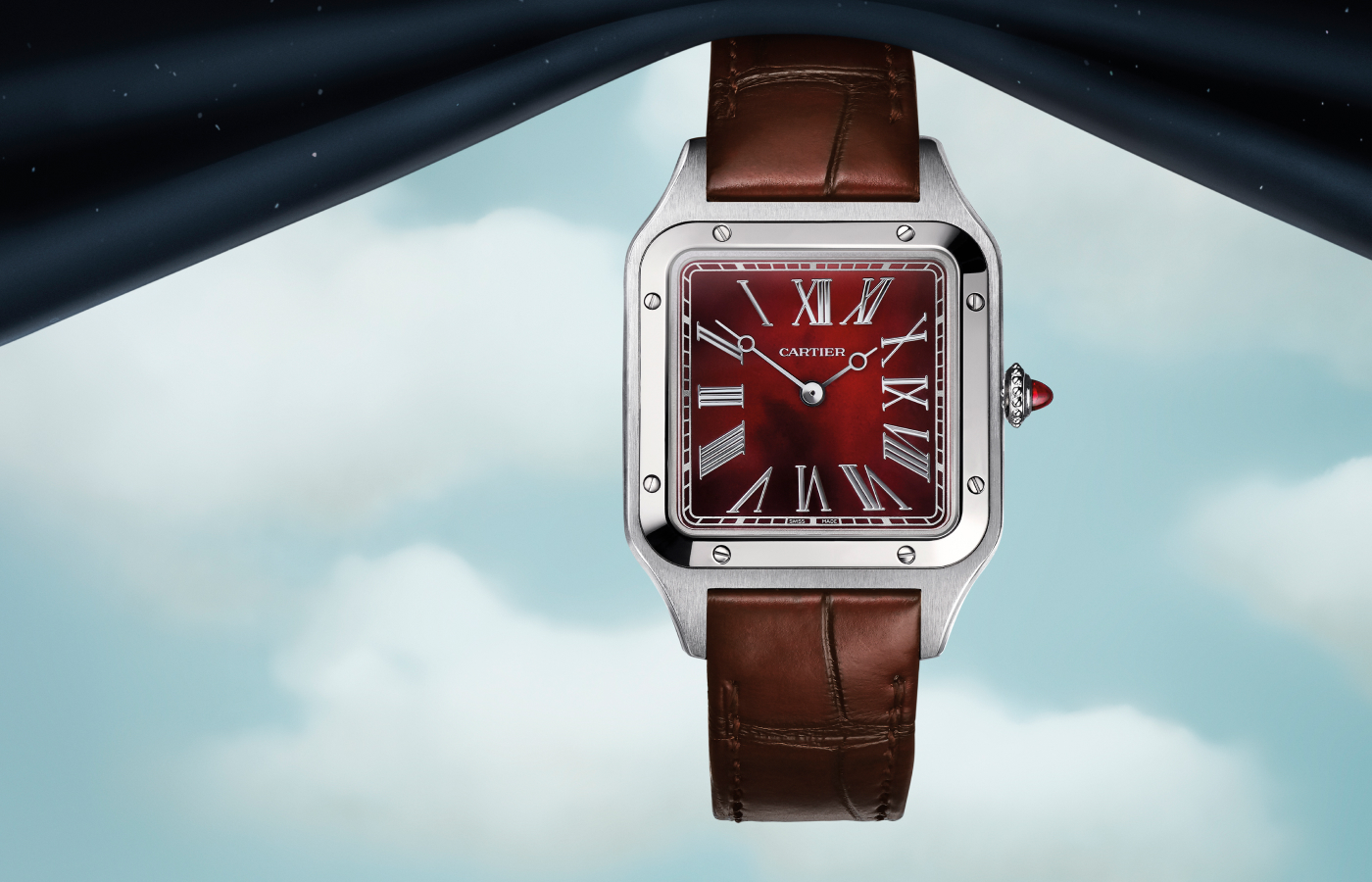 Cartier Santos-Dumont Rewind watch in platinum with a carnelian dial, ruby cabochon, inverted Roman numerals and rhodium-finish steel apple-shaped hands