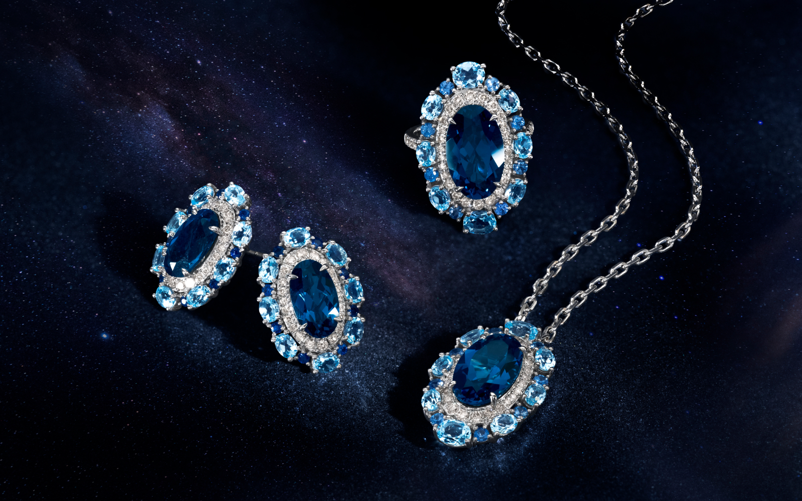 Le Vian® earrings, pendant and ring with Deep Sea Blue Topaz™, blue topaz, Blueberry Sapphire™ and Nude Diamonds™ set in 14K Vanilla Gold®