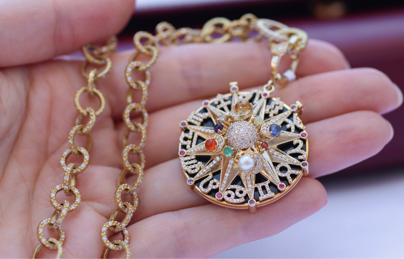 COOMI Chameleon pendant depicting the signs of the zodiac with 1.44 carats of diamonds and 1.25 carats of mixed coloured stones and pearls, set in 18k yellow gold 