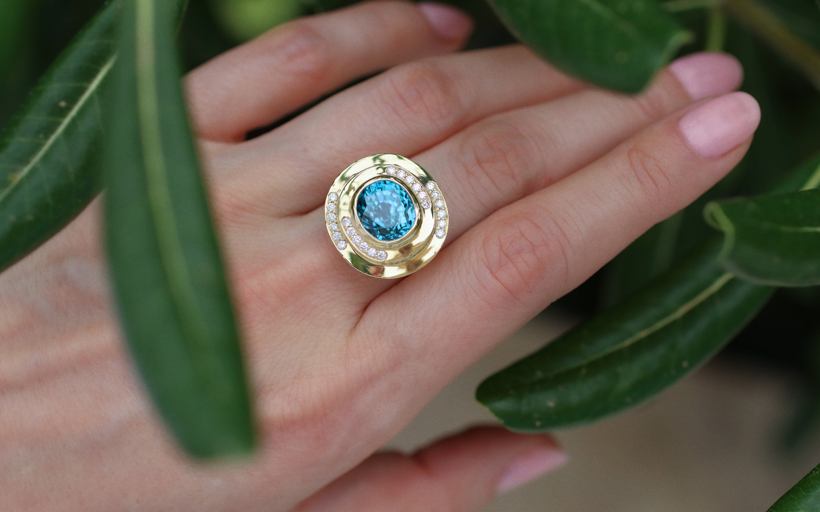 Katerina Perez wears a Florence Carr cocktail ring with an 11.92 carat blue zircon and diamonds accents, set in 18k yellow gold 