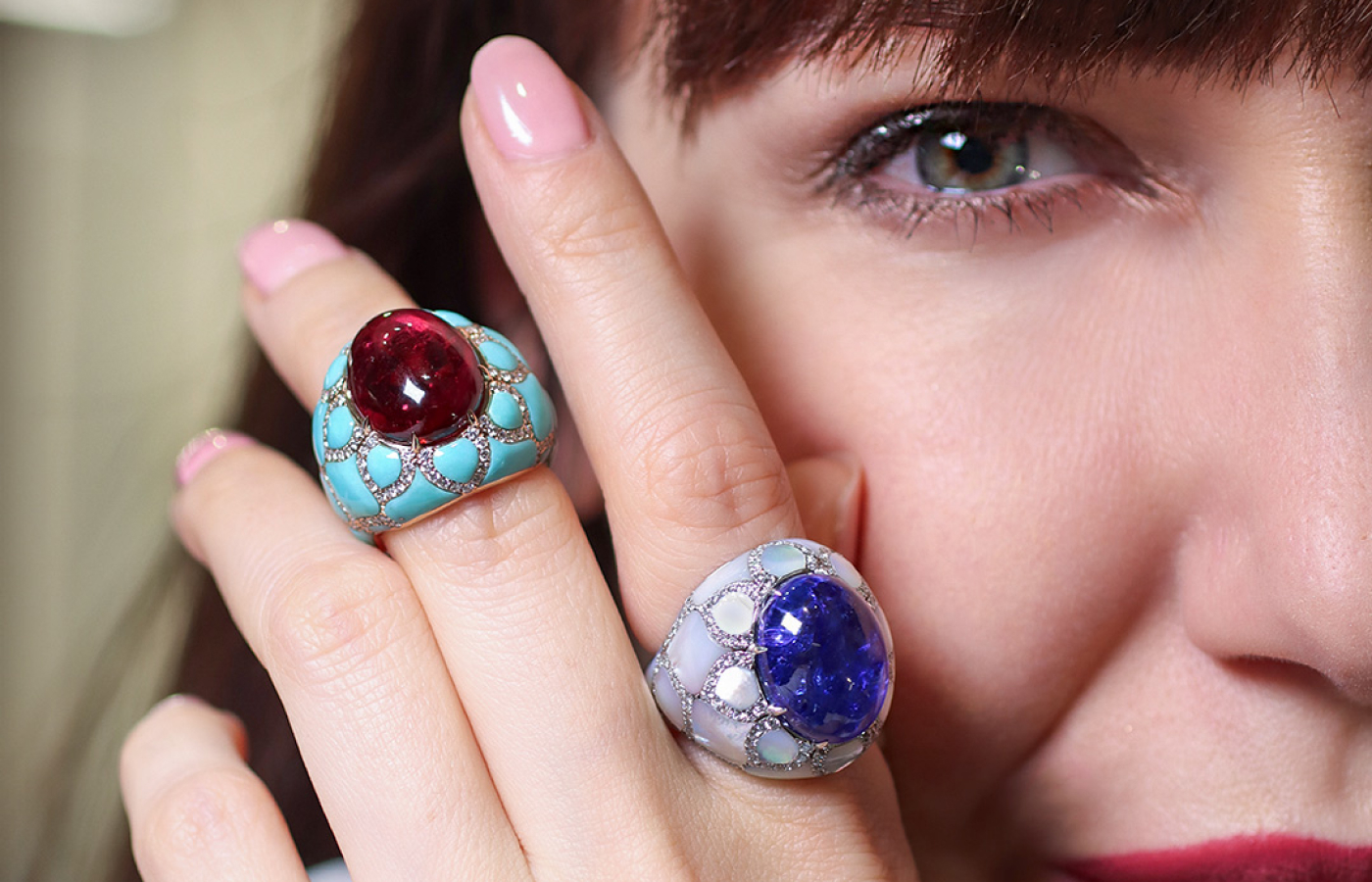 Katerina Perez wears two cocktail rings from the Maison J’OR Harem collection, including an 11.15 carat rubellite cabochon ring with turquoise and natural diamonds, set in 18k rose gold 