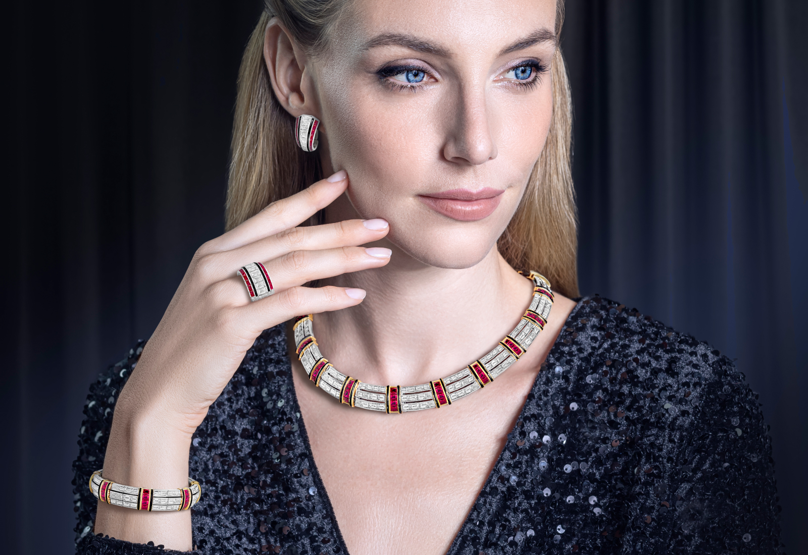 A model wears Picchiotti creations with buff top rubies, baguette-cut diamonds and onyx, set in 18k white and yellow gold 