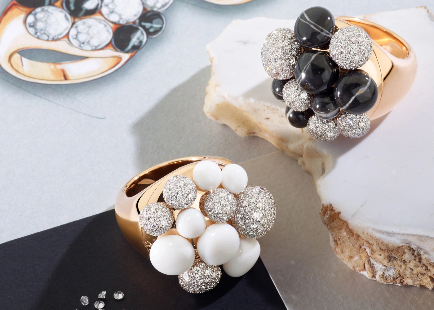 Mora rings reimagined by Pomellato featuring clusters of black marble and white diamonds (right) and kogolong and diamonds (left), both set in rose gold   