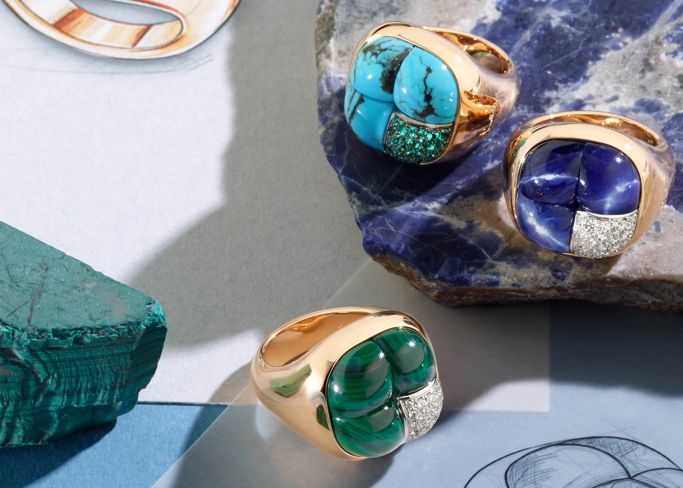 Mosaico rings by Pomellato featuring turquoise and emeralds, sodalite and diamonds (top), skarn and chrome tourmalines (bottom), all set in rose gold