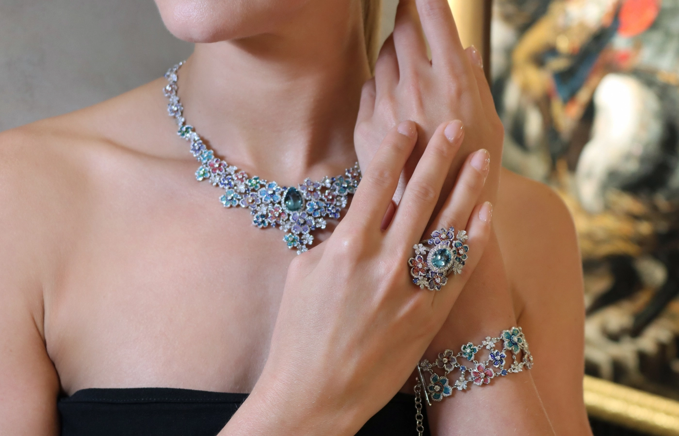 A model wears the Sicis Giardino Estate set, including a necklace, bracelet and ring in white gold with diamonds, aquamarine and sapphires at the opening of the Sicis boutique in Paris 