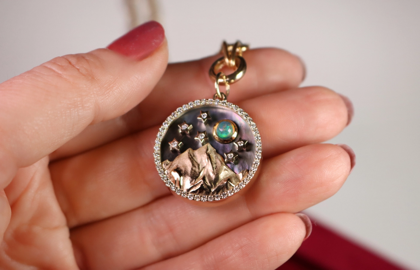 Lionheart Zenith Mountain Medallion with grey mother of pearl, opal and 1.10 carats of diamonds set in 14k yellow gold 