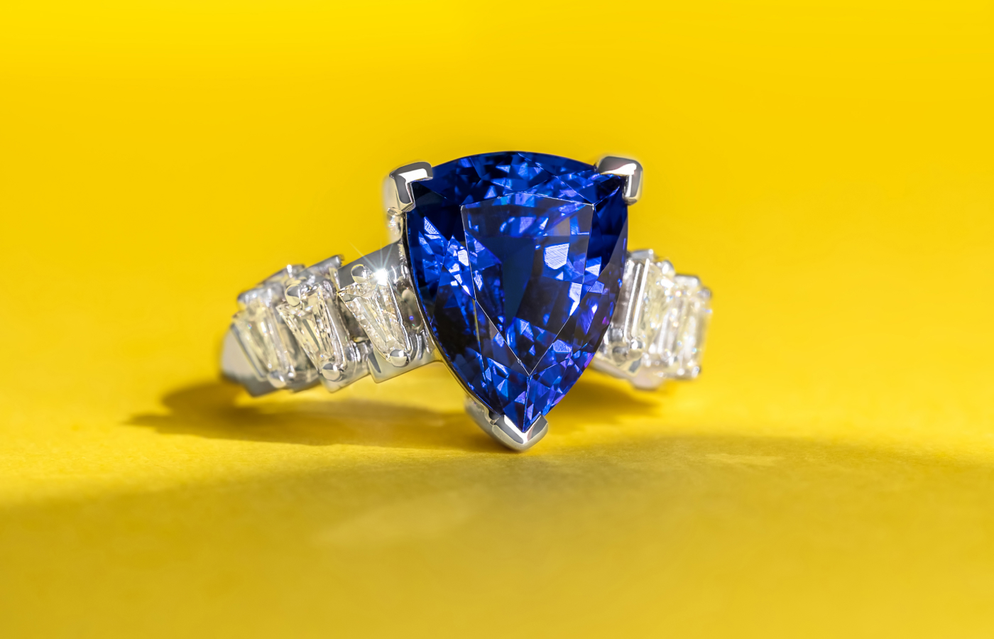 MADLY bespoke ‘Shield Against the Chaos’ ring with a shield-shaped tanzanite and tapered diamond baguettes in 18k gold 