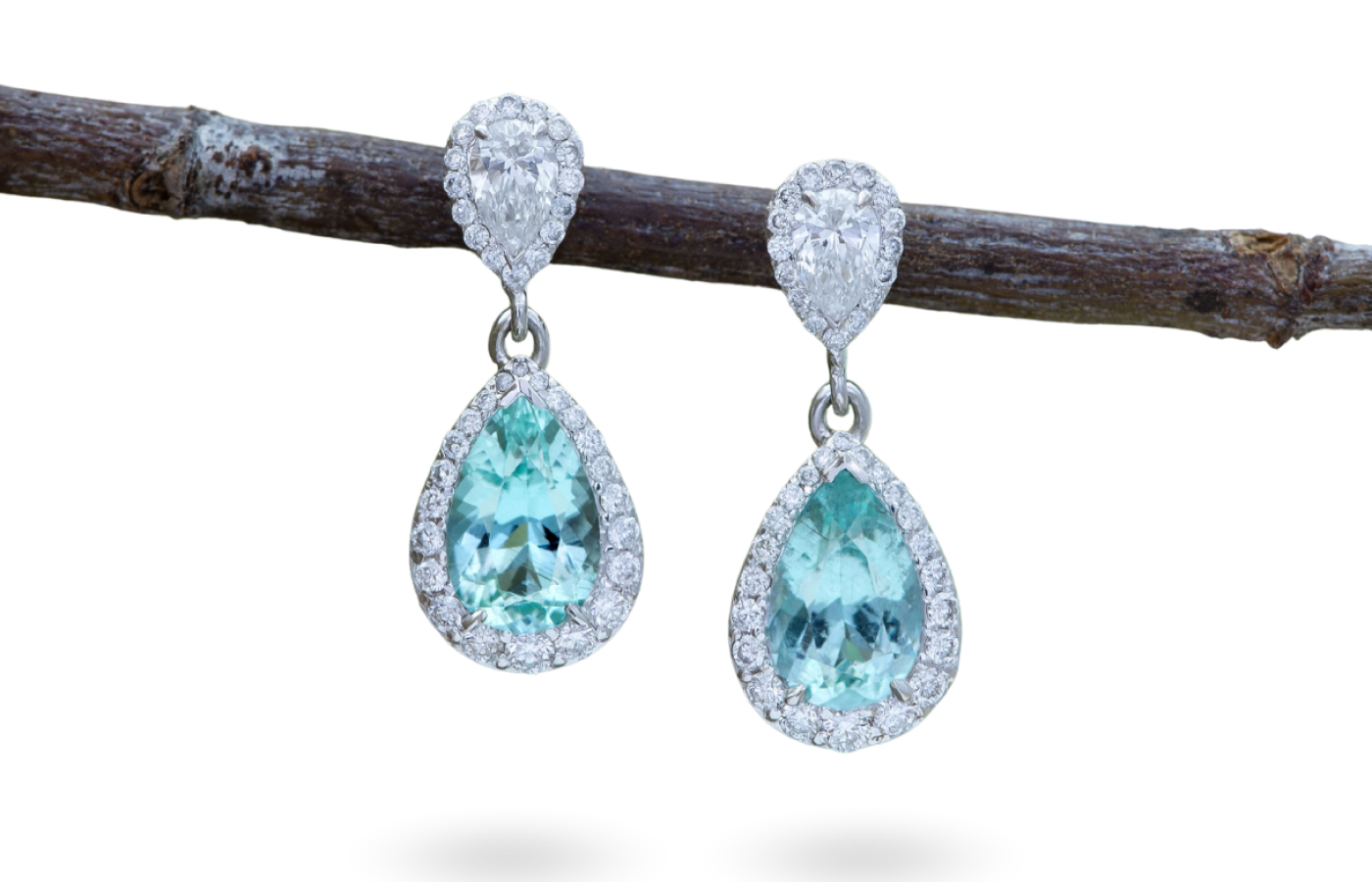 Morebelli earrings with two Paraiba tourmalines of 2.08 carats originating from Ikalamavony, Madagascar, surrounded by 80 diamonds with a total weight of 1.18 carats 