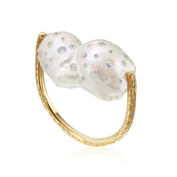 Baroque pearl ring inlaid with diamonds on a yellow gold band