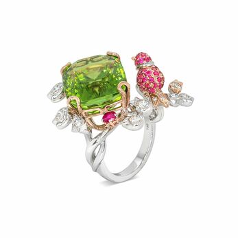 Ring with a 15ct peridot gem alongside a hot pink three-dimensional bird with diamonds in white gold 