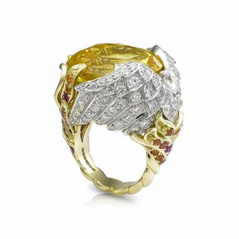 Phoenix ring with a 41ct yellow sapphire alongside rubies, yellow and orange sapphires and diamonds in 18k yellow gold 