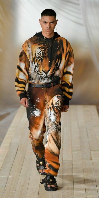 A model wears tiger print on the SS22 catwalk