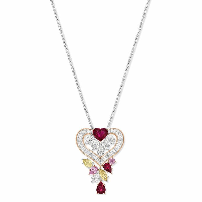 Winston Promise pendant with 32 baguette and six pear-shaped colourless diamonds weighing approx. 3.73 carats, alongside a 1.39 carat heart-shaped ruby, two pear-shaped rubies of 1.33 carats, two round and pear-shaped pink sapphires, and two marquise and pear-shaped fancy yellow diamonds set in platinum and 18K rose gold