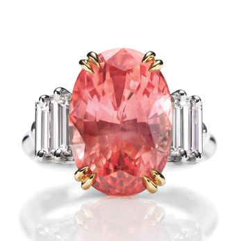 Ring with oval cut 11.41ct Padparadscha sapphire and diamonds in yellow and white gold