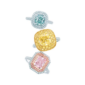 Rings (from top): with cushion-cut fancy intense bluish green diamond in platinum , square antique modified brilliant cut fancy yellow diamond ring with melee diamond border in platinum and 18 karat yellow gold, and cushion mixed-cut fancy intense purplish pink diamond ring with pink diamond in platinum and 18 karat rose gold