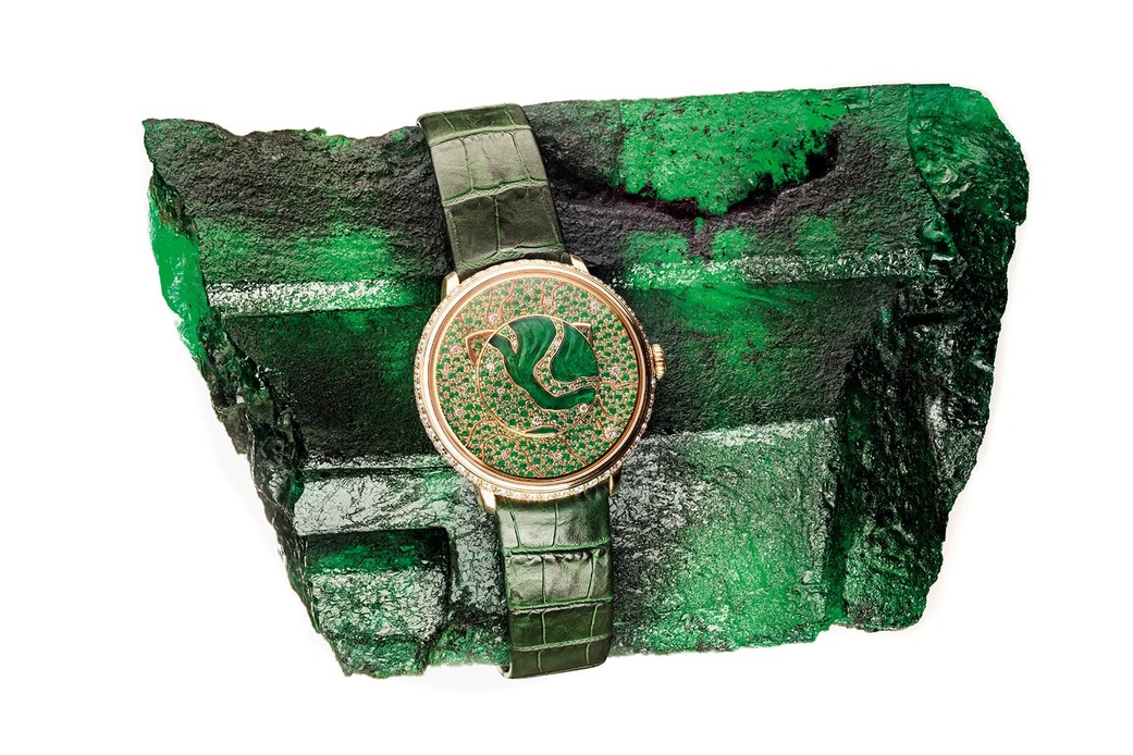 ‘Lady Libertine II’ timepiece with hand carved rough emeralds and diamonds in 18k yellow gold on Gemfields’ Inkalamu, the 5,655 carat Zambian ‘Lion’ emerald
